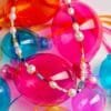 Featuring freshwater pearls, vibrant glass beads, and natural gemstones, all beautifully finished with a gold-plated brass closure