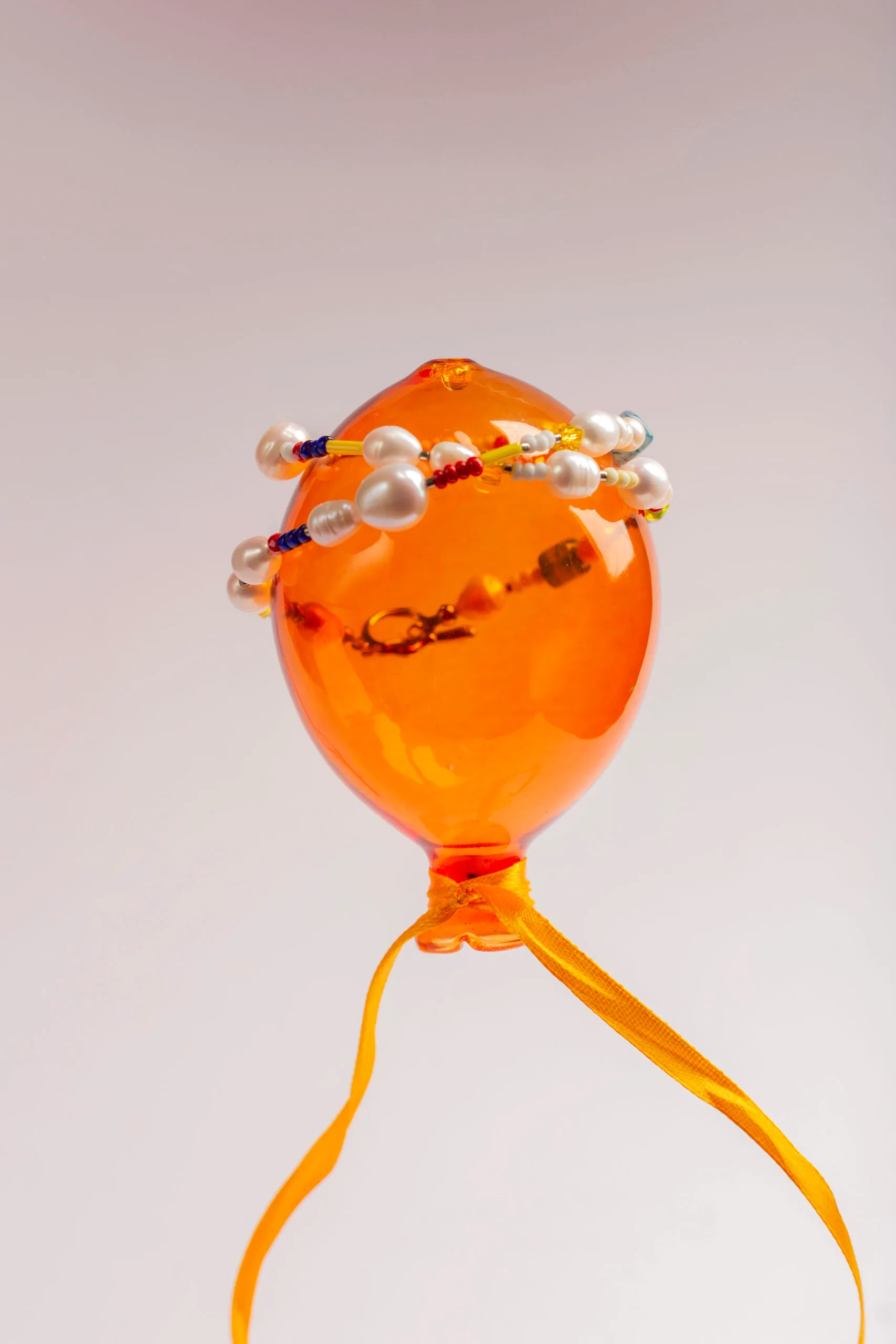 Featuring freshwater pearls, vibrant glass beads, and natural gemstones, all beautifully finished with a gold-plated brass closure