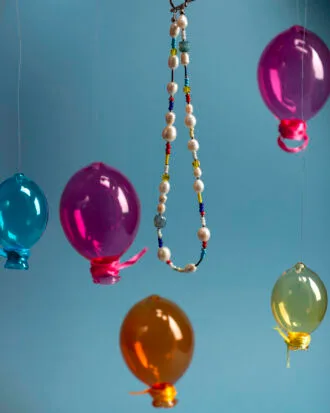 Featuring freshwater pearls, vibrant glass beads, and natural gemstones, all beautifully finished with a gold-plated brass closure