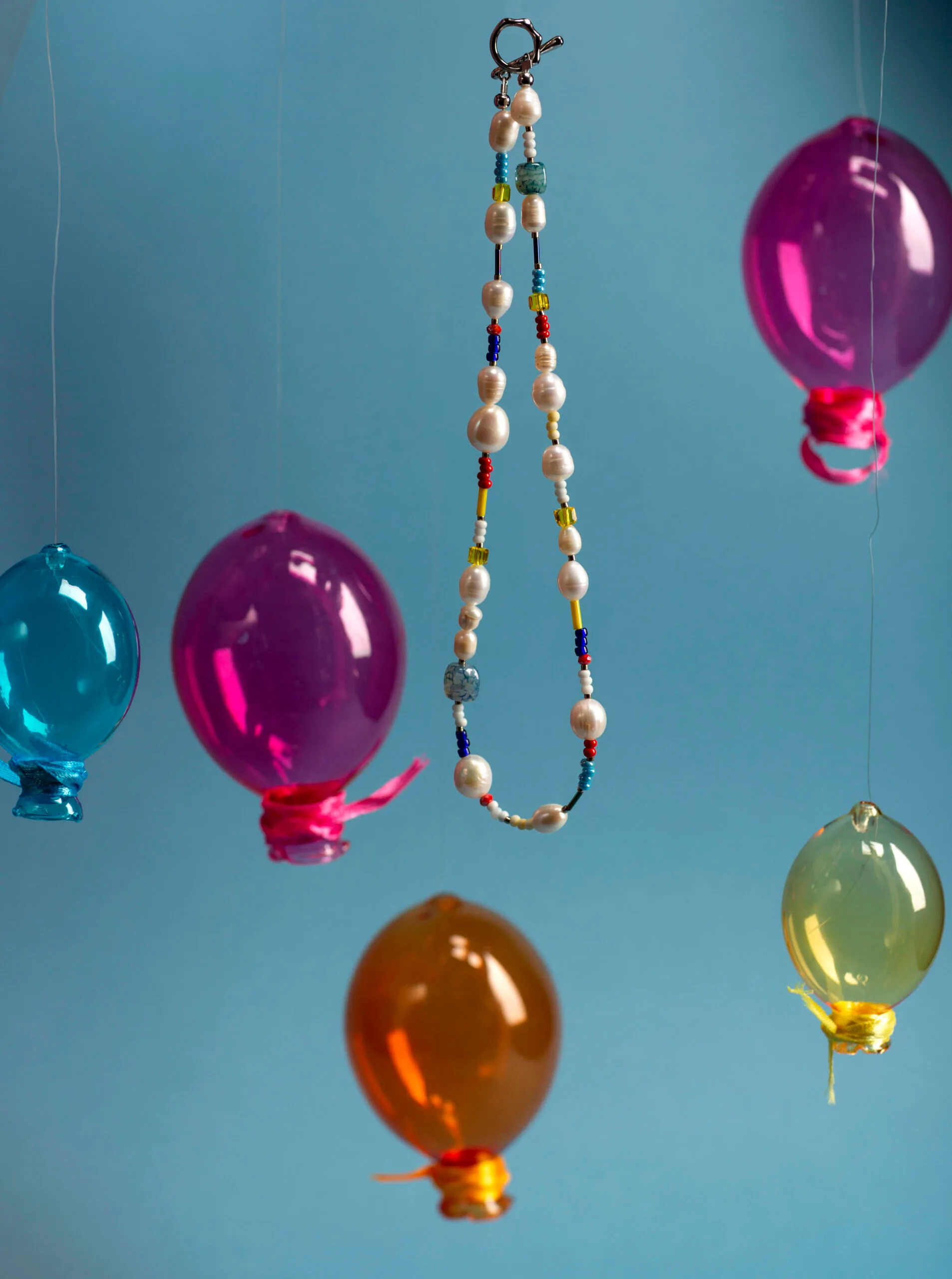 Featuring freshwater pearls, vibrant glass beads, and natural gemstones, all beautifully finished with a gold-plated brass closure