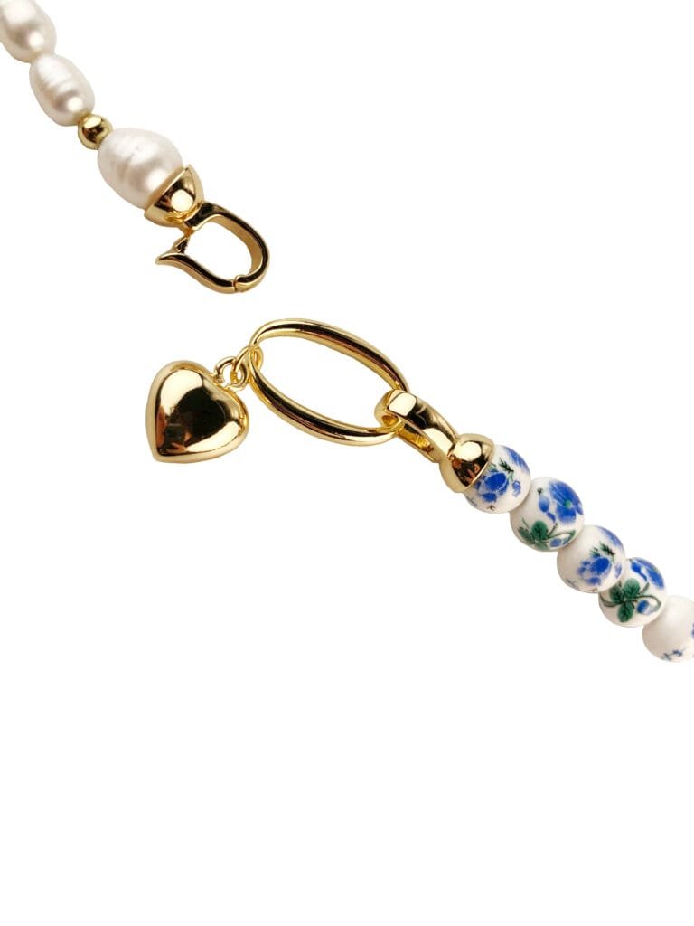 Natural freshwater pearls, brass pendant, ceramics, glass beads, garnet stone