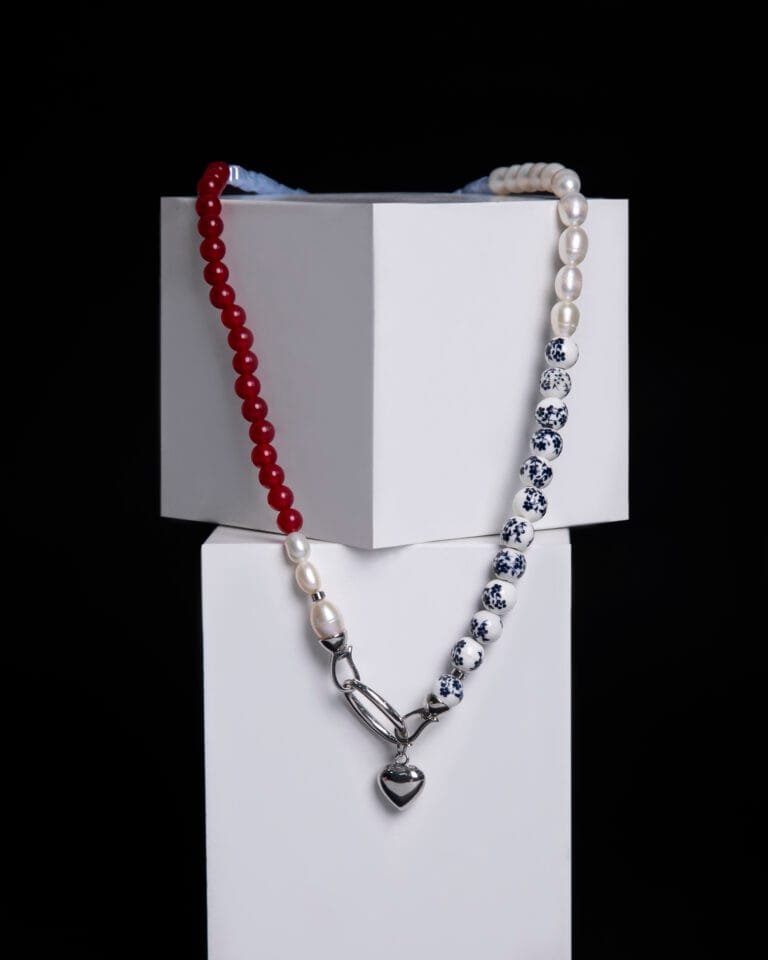 Natural freshwater pearls, brass pendant, ceramics, glass beads, garnet stone